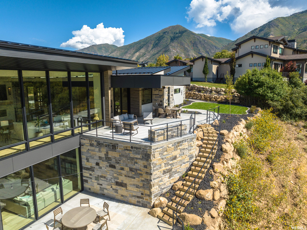 View of terrace featuring a mountain view and an outdoor living space