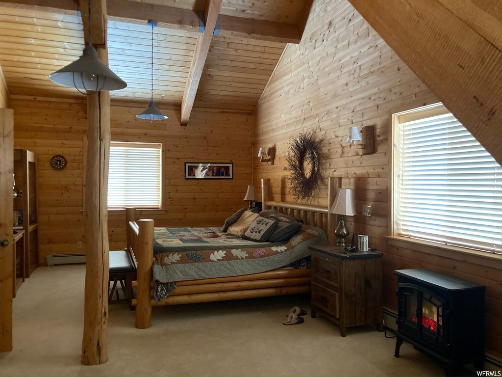 Carpeted bedroom featuring vaulted ceiling with beams, wood walls, wood ceiling, and a wood stove