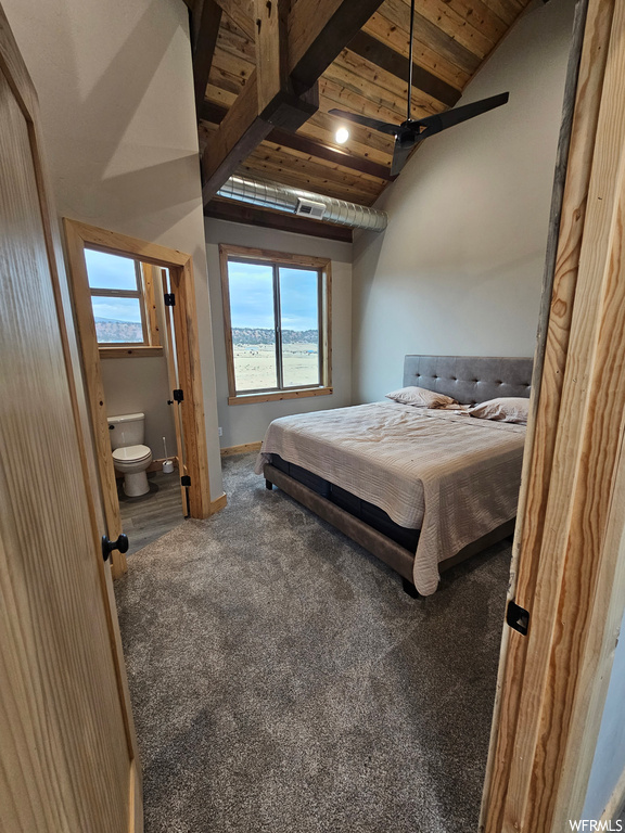 Carpeted bedroom with ensuite bath, lofted ceiling, wood ceiling, and ceiling fan