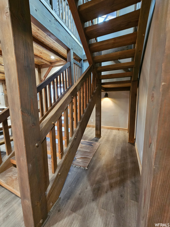 Corridor featuring dark hardwood / wood-style floors