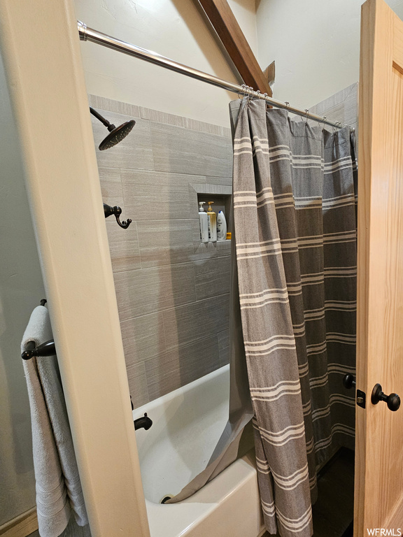 Bathroom featuring shower / tub combo