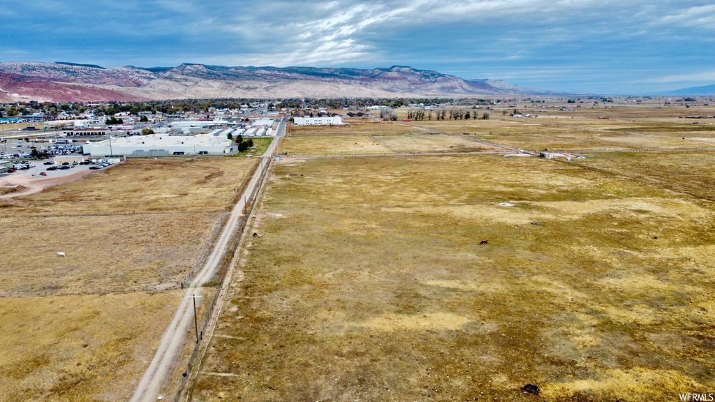 Birds eye view of property featuring a mountain view and a rural view