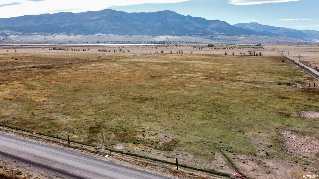 Property view of mountains with a rural view