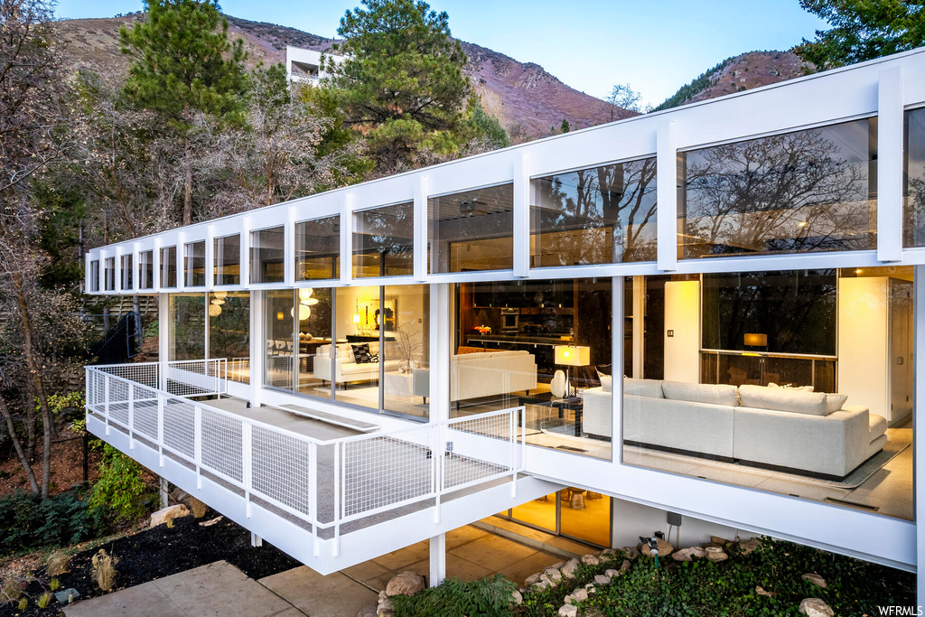 Exterior space featuring a mountain view and an outdoor hangout area
