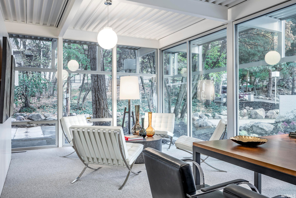 Sunroom / solarium with plenty of natural light and beamed ceiling
