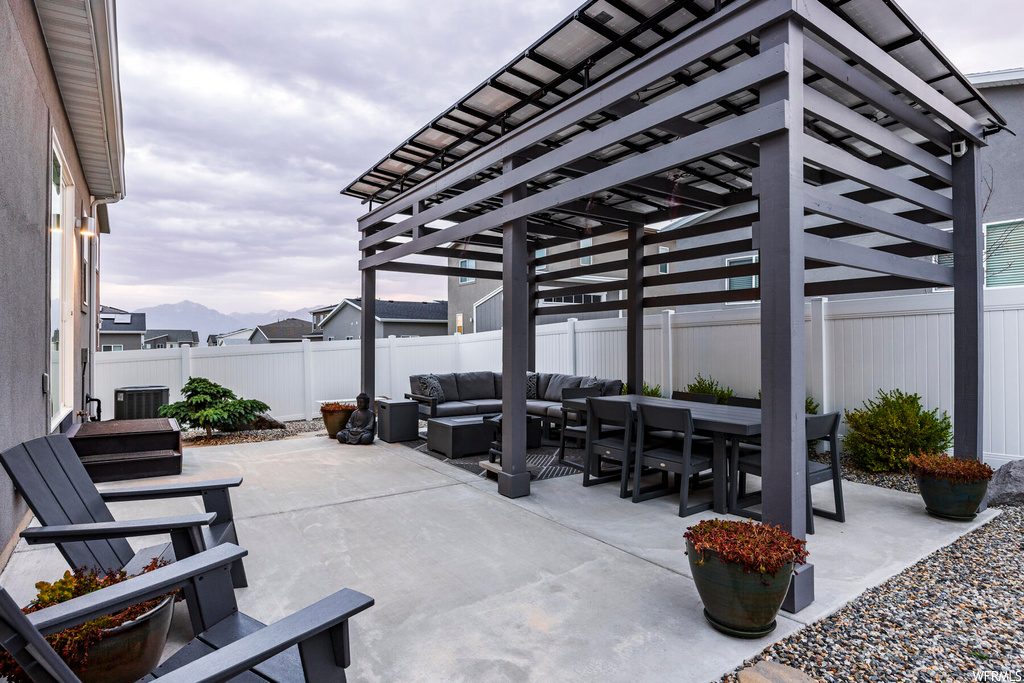 View of patio featuring a pergola and an outdoor living space