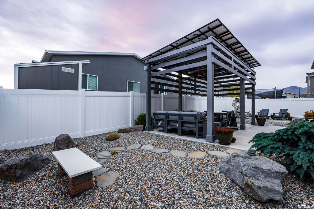 Exterior space with an outdoor living space and a pergola