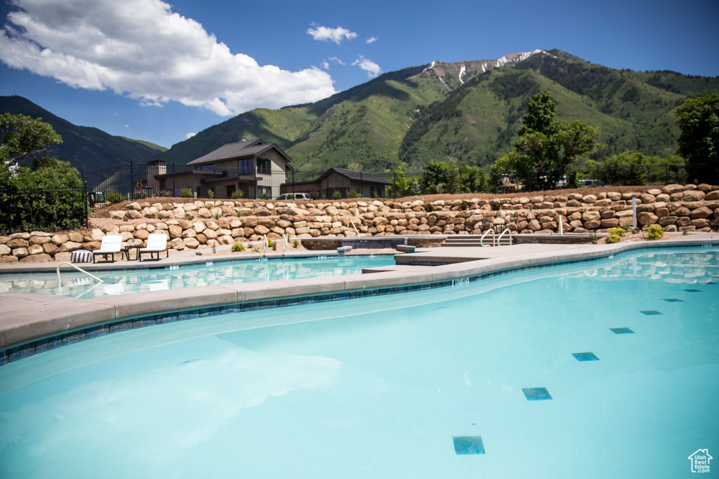 View of swimming pool featuring a mountain view