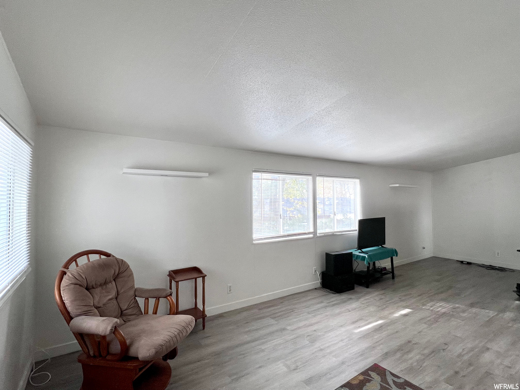 Living area featuring light hardwood / wood-style floors