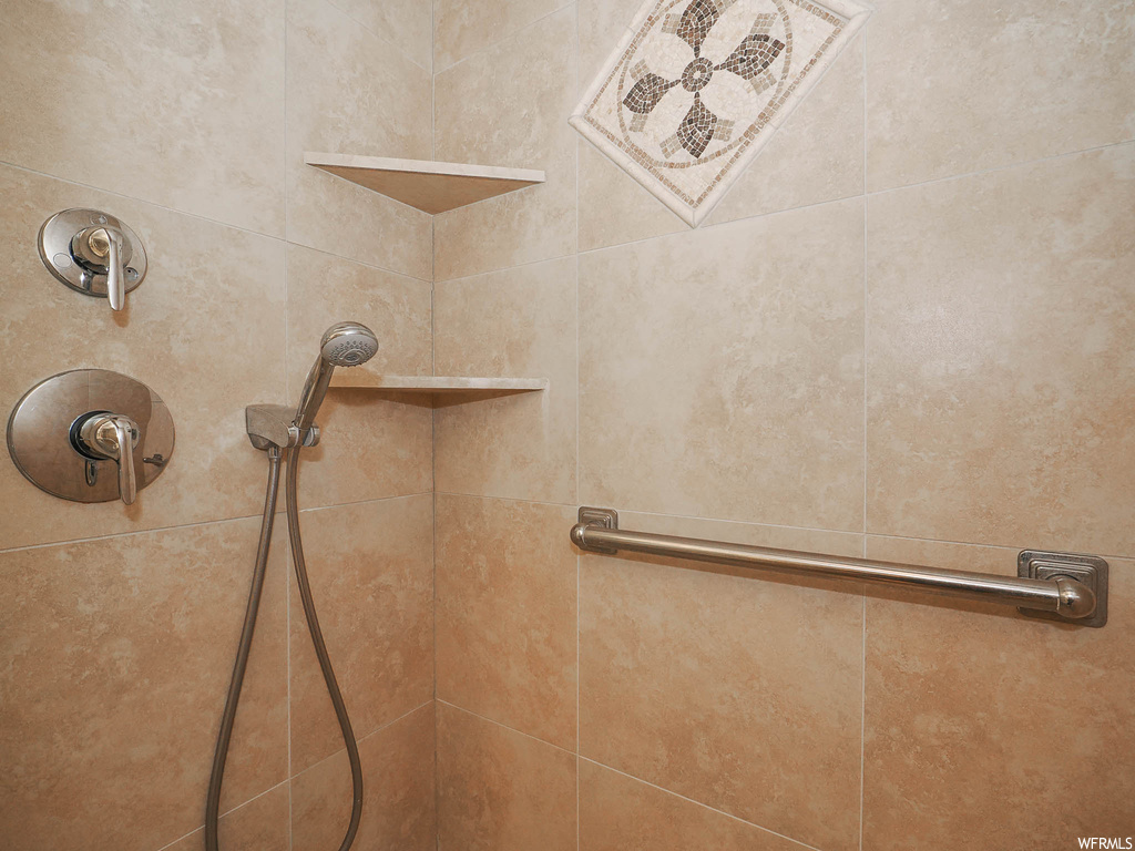 Details featuring tiled shower