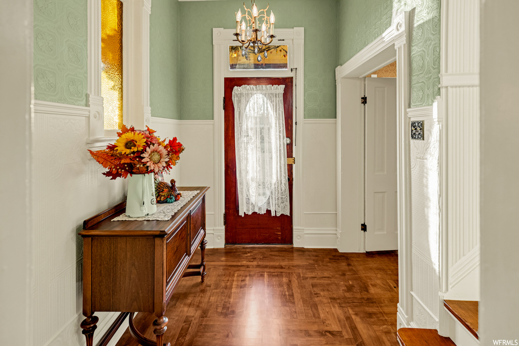 Entryway with a notable chandelier