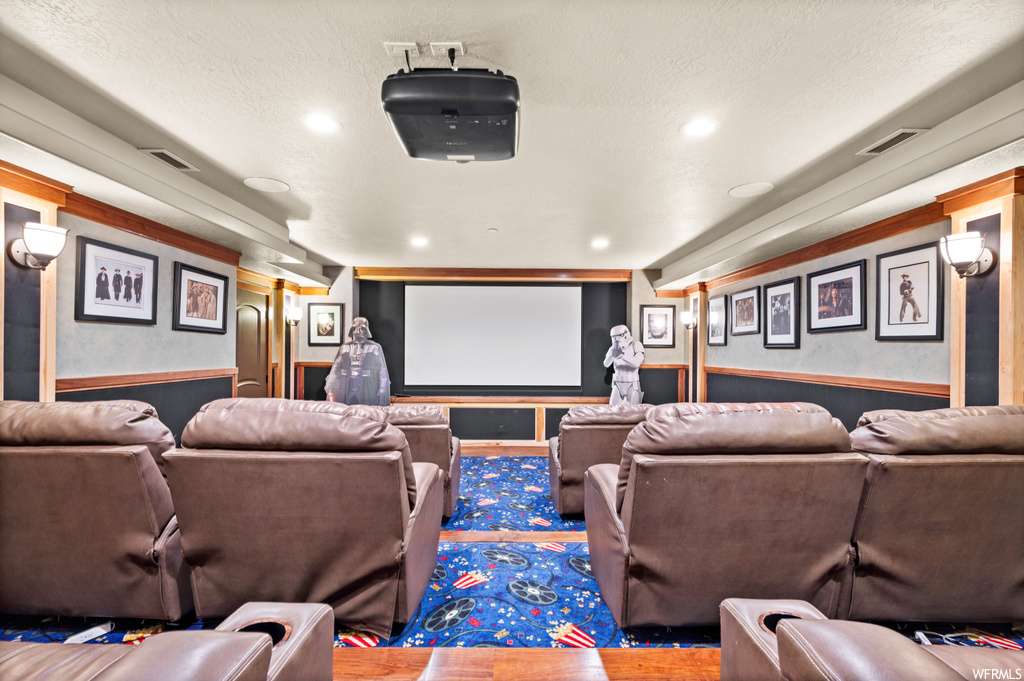 Home theater room with a textured ceiling