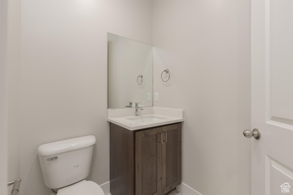 Bathroom featuring toilet and vanity