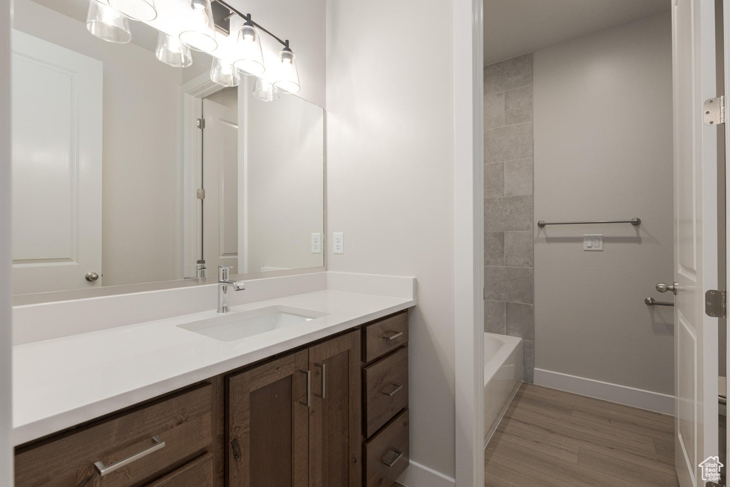 Bathroom with vanity and wood-type flooring