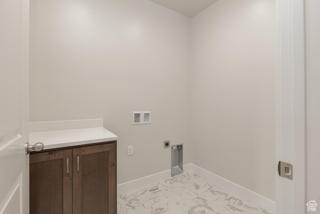 Laundry room featuring light tile patterned flooring, electric dryer hookup, and washer hookup