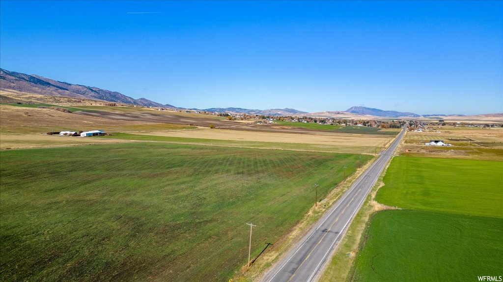 Property view of mountains with a rural view