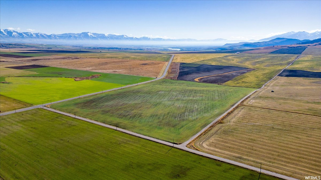 Drone / aerial view with a mountain view and a rural view