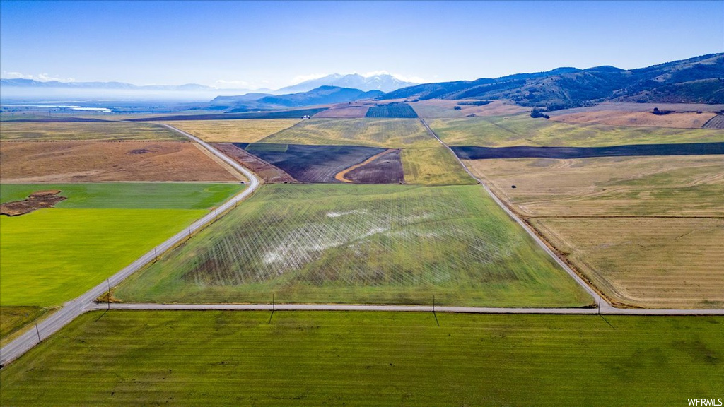 Drone / aerial view with a mountain view and a rural view