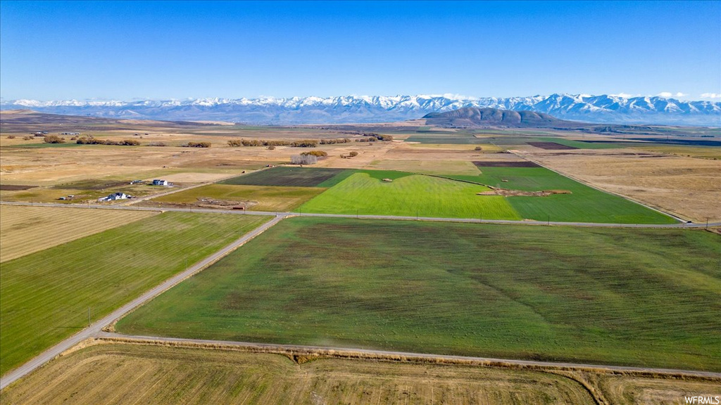 Birds eye view of property featuring a mountain view and a rural view