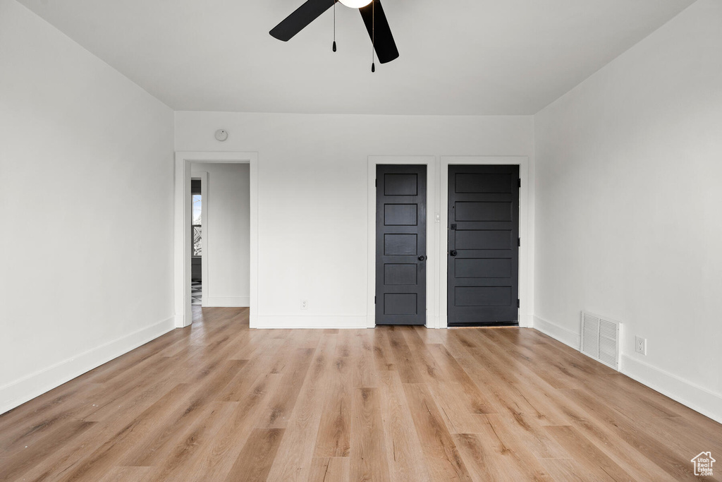 Unfurnished bedroom with light hardwood / wood-style floors and ceiling fan