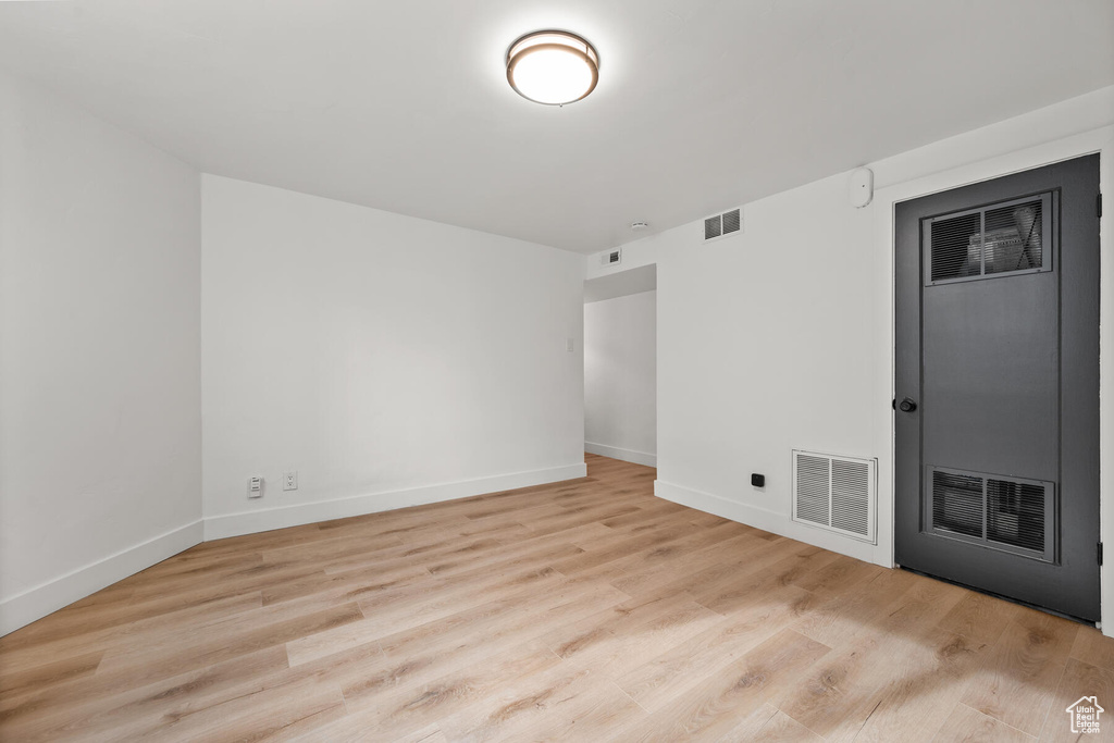 Spare room with light wood-type flooring