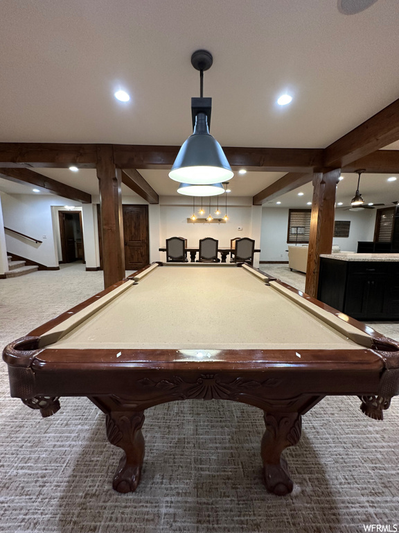 Playroom with light carpet, pool table, and beamed ceiling