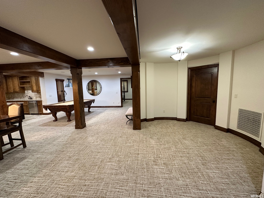 Game room featuring billiards, light carpet, and beam ceiling