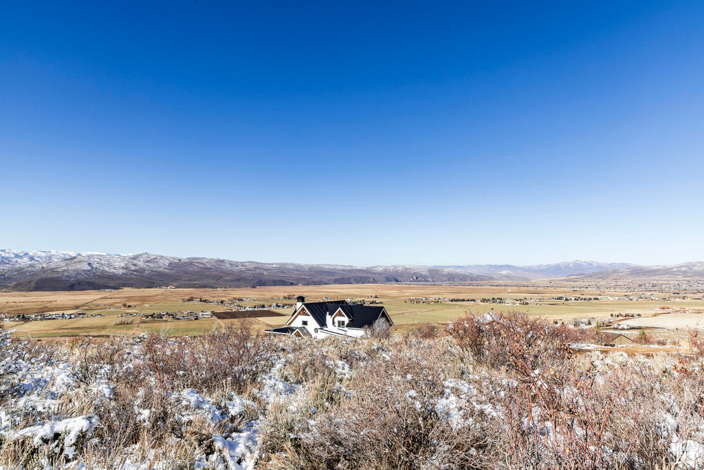 Drone / aerial view with a mountain view and a rural view