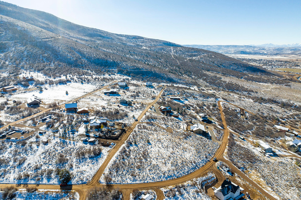 Snowy aerial view featuring a mountain view