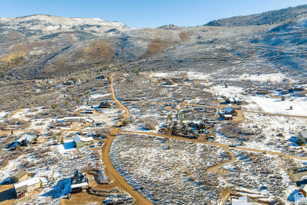 Snowy aerial view with a mountain view