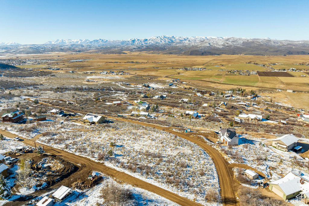 Snowy aerial view featuring a mountain view