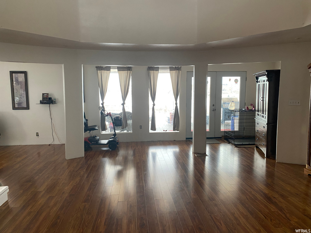 Interior space featuring dark wood-type flooring