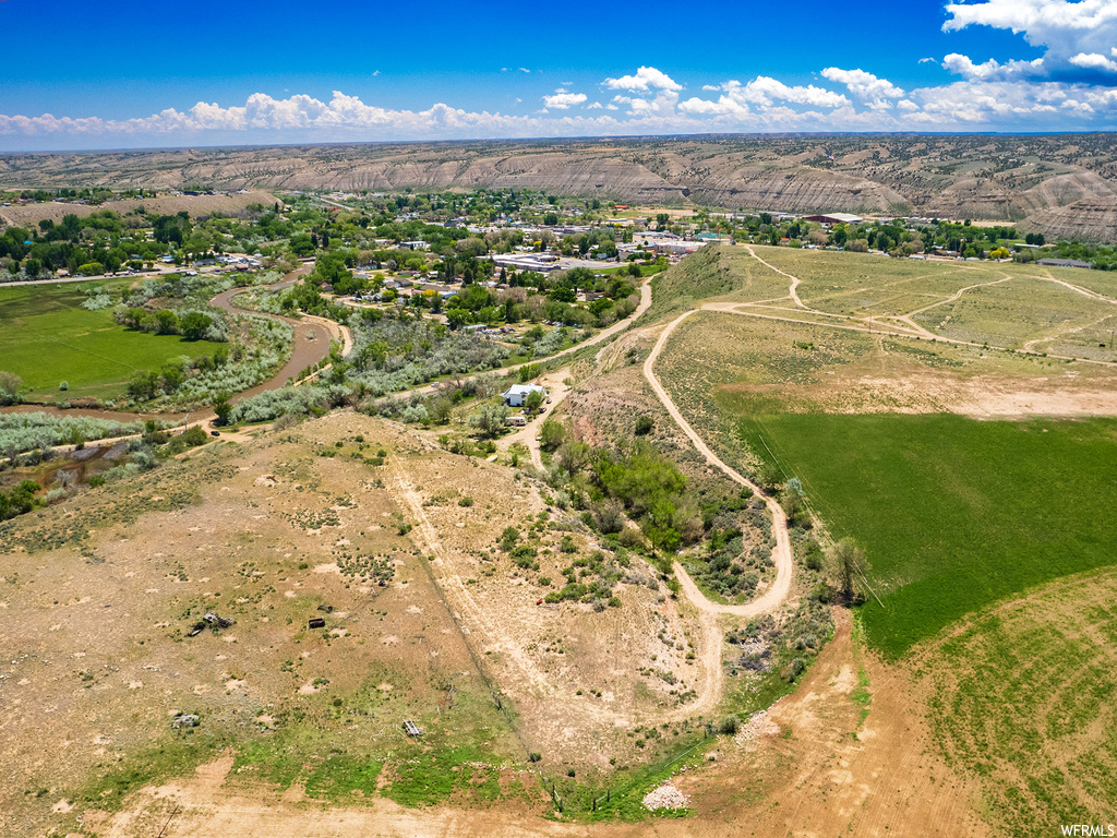 Birds eye view of property with a rural view