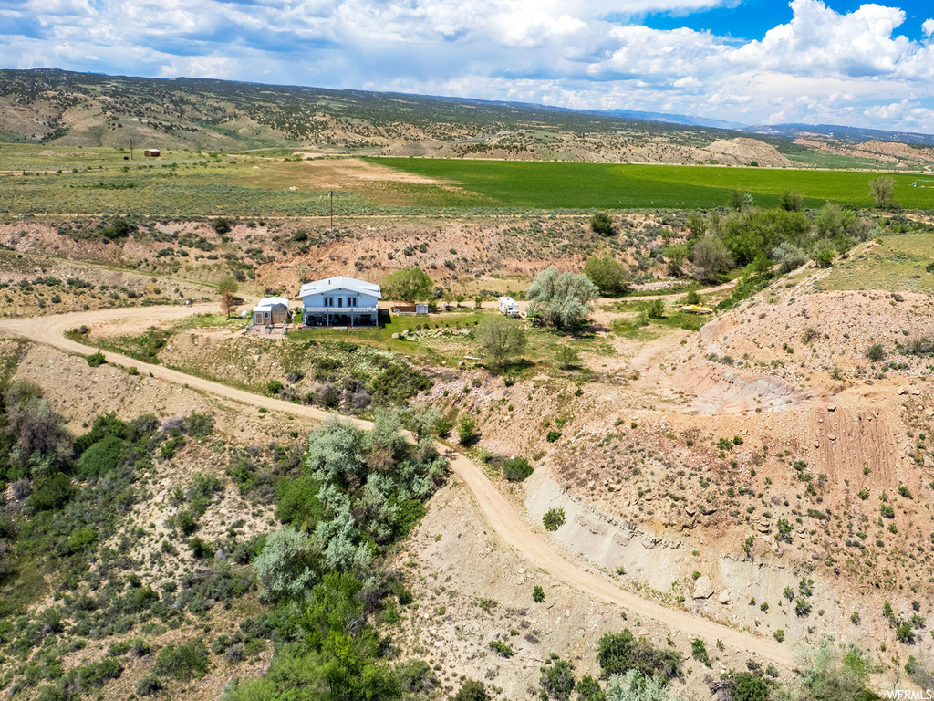 Birds eye view of property with a rural view