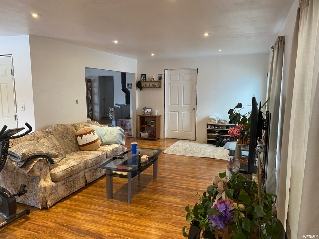 Living room with light hardwood / wood-style flooring