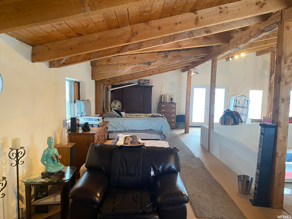 Tiled bedroom featuring wooden ceiling and vaulted ceiling with beams