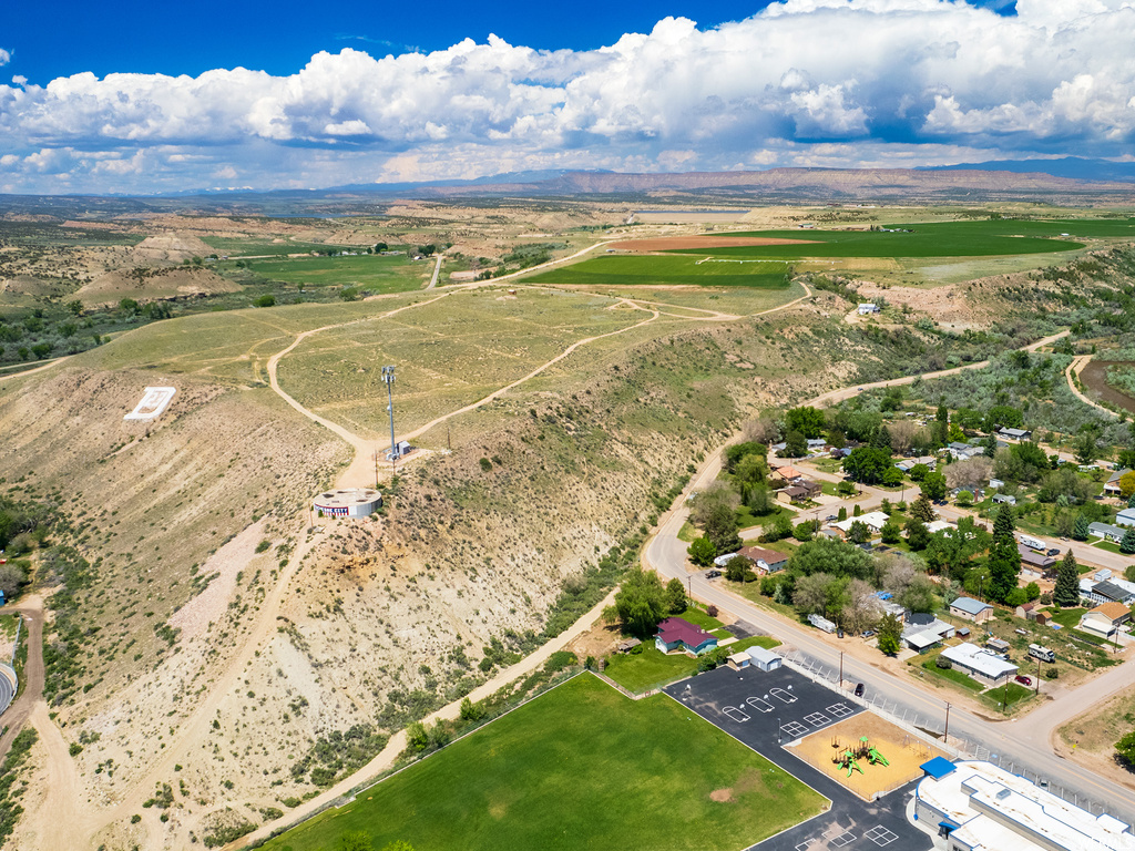 Birds eye view of property featuring a rural view