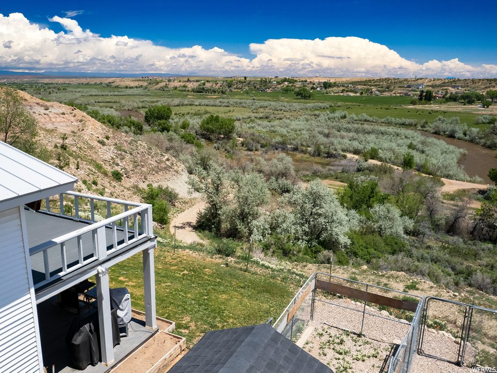 Property view of mountains with a rural view