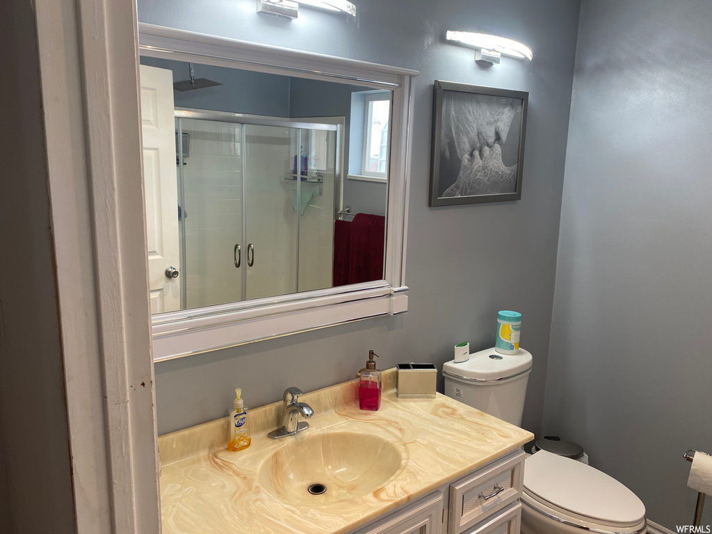 Bathroom featuring toilet and vanity