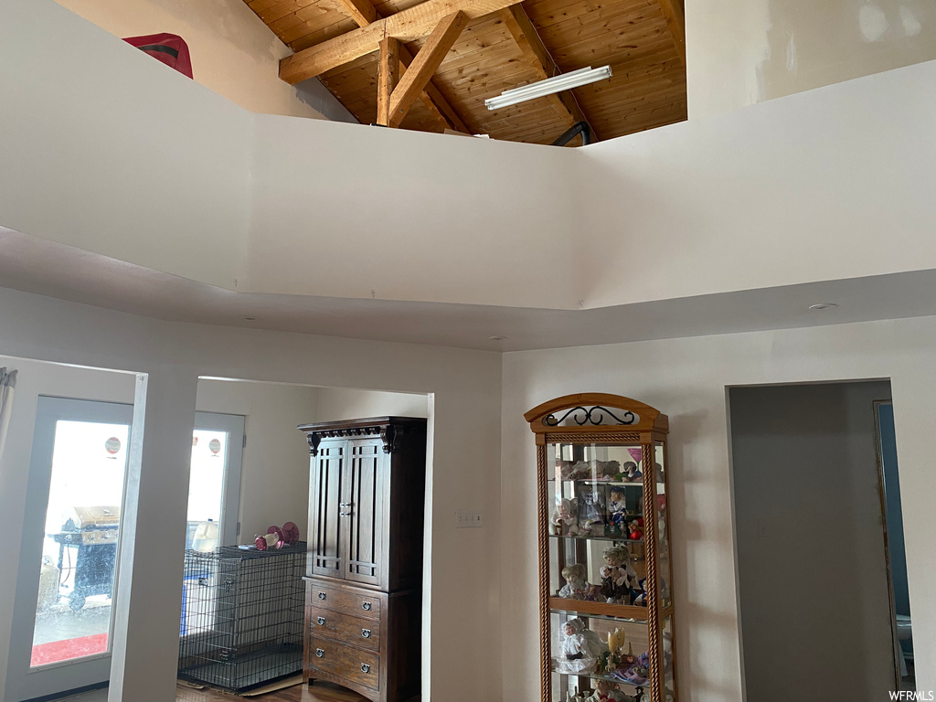 Interior space featuring wooden ceiling and beamed ceiling