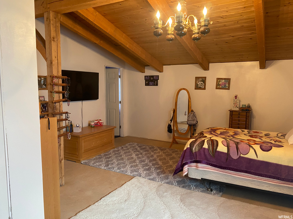 Bedroom with wood ceiling, a chandelier, lofted ceiling with beams, and carpet floors