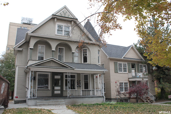 Victorian-style house with covered porch