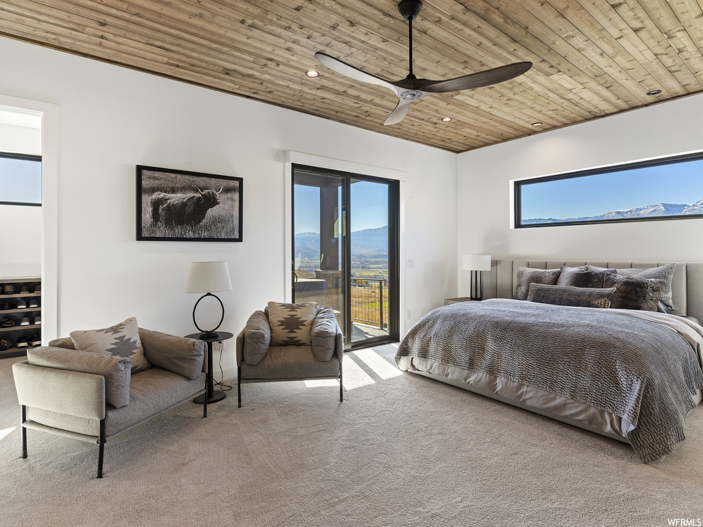 Bedroom featuring light carpet, wood ceiling, ceiling fan, and access to exterior