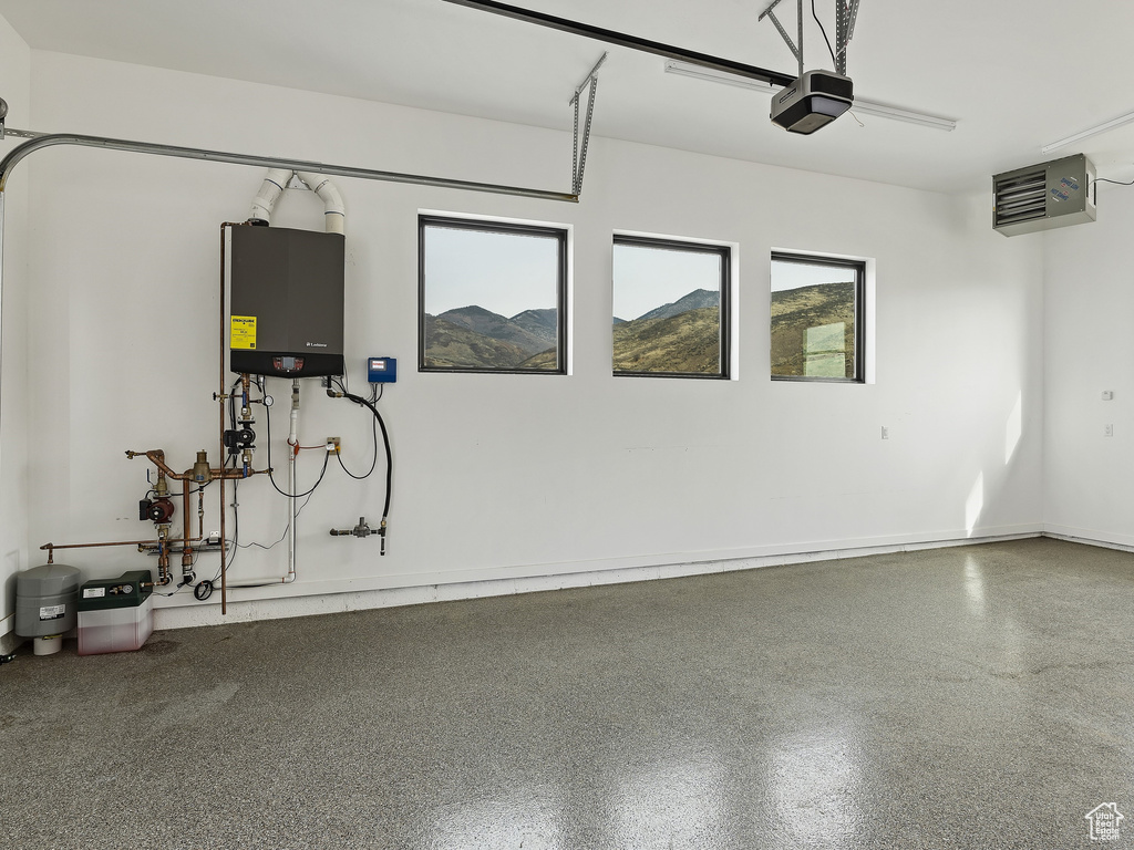 Garage featuring water heater and a mountain view
