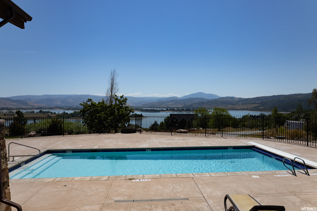 View of pool with a mountain view