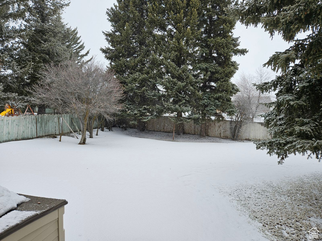 View of yard covered in snow