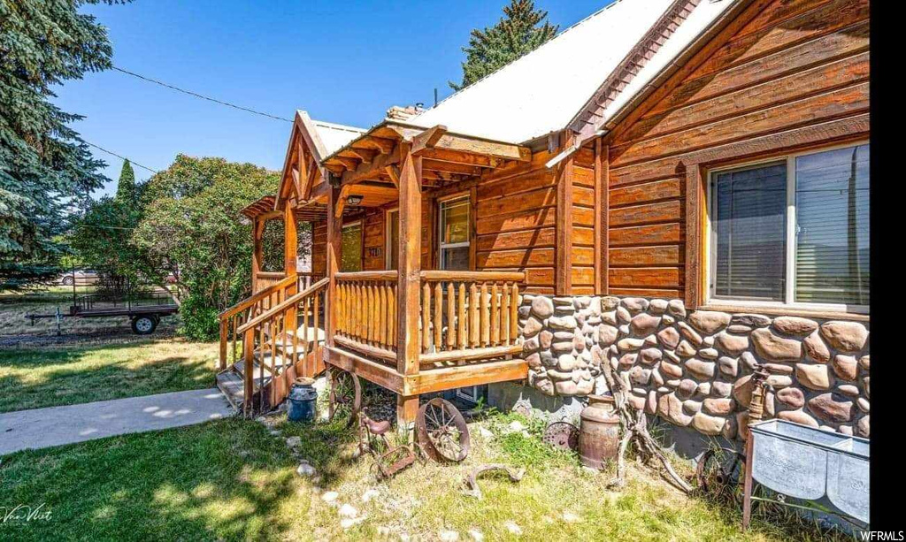 Wooden terrace with a yard