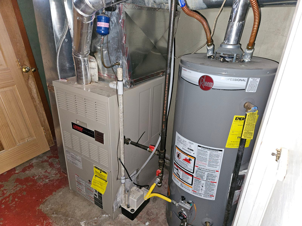 Utility room with heating utilities and water heater