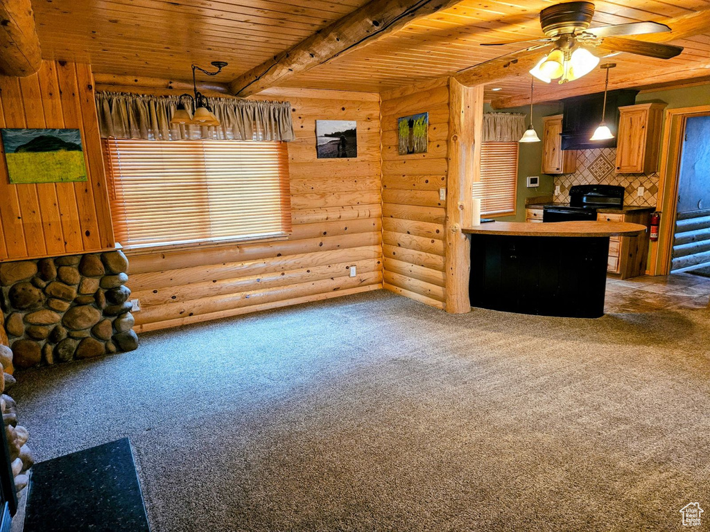 Kitchen featuring ceiling fan, wooden ceiling, black range with electric cooktop, hanging light fixtures, and carpet floors