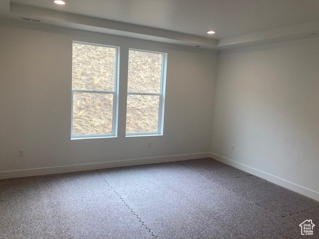 Unfurnished room featuring plenty of natural light